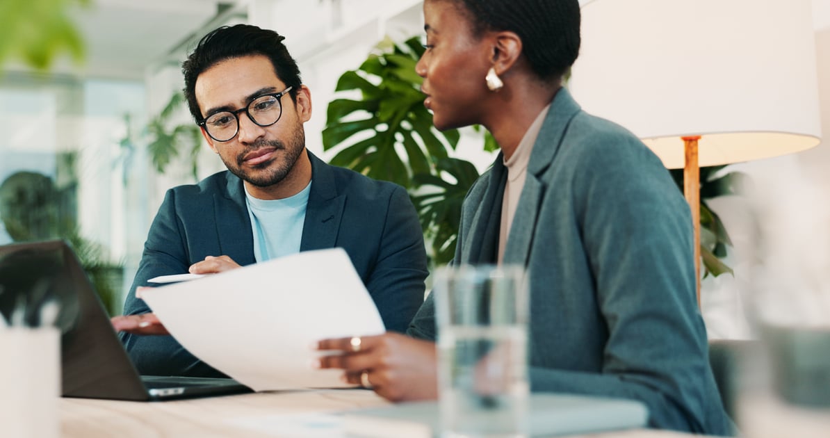 Business people looking at documents